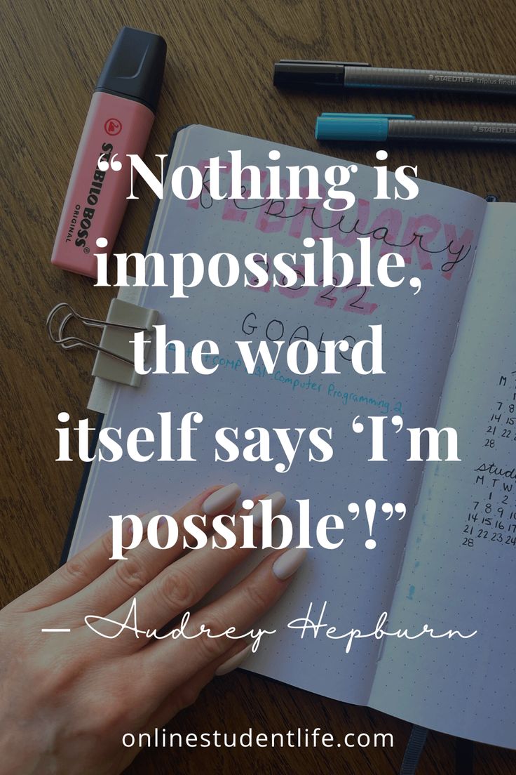 someone is writing on a notebook with the words nothing is impossible, the word itself says i'm possible