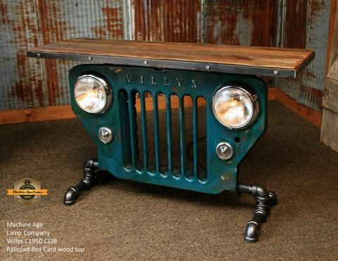 an old jeep grill with two lights on it