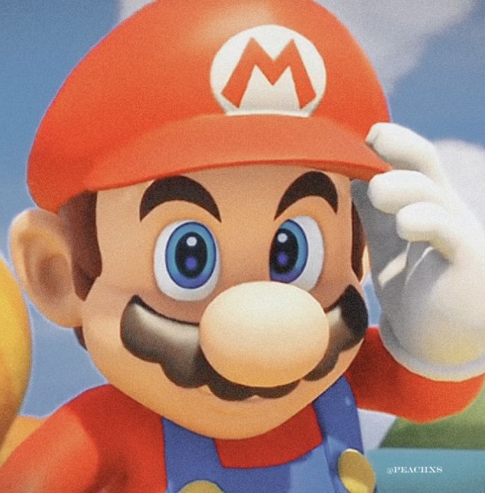 an image of a mario bros character with big blue eyes and a red hat on