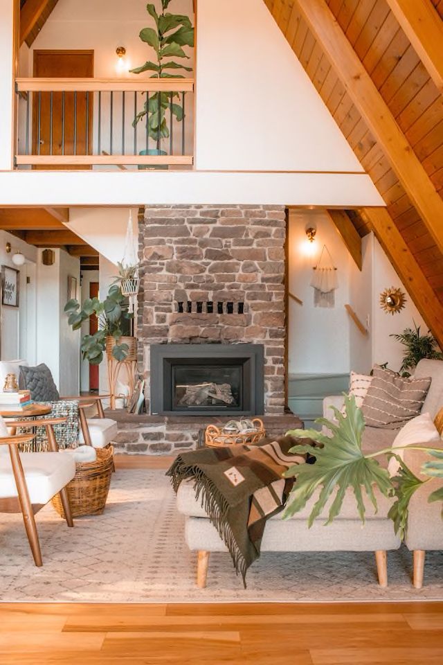 a living room filled with furniture and a fire place