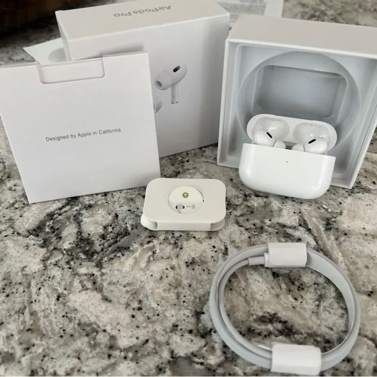 an apple airpods in its box on a marble counter