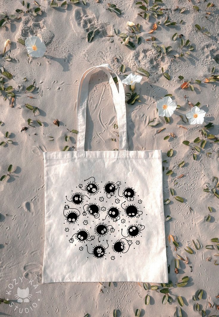 "- 100% Cotton Reusable Tote Bag, with cute soot sprites on it! - 15\"W x 16\"H - Each tote is made to order. Location & size of print may slightly vary for each item.  - Heat pressed, permanent vinyl logo - Spot clean only" Soot Sprite Crochet Bag, Soot Sprite Studio Ghibli, Soot Sprite Pillow, Ghibli Soot Sprites, Soot Sprite Keychain, Vinyl Logo, Soot Sprite, Soot Sprites, Embroidery Bags