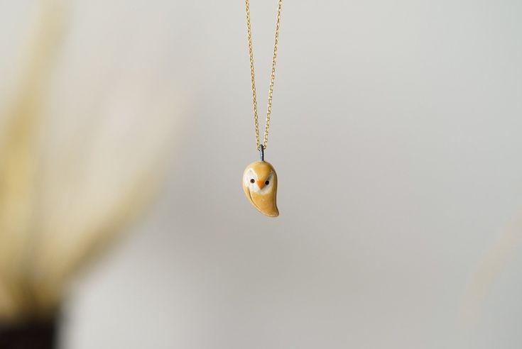 This handmade ceramic necklace is made of stoneware clay, hand shaped without any mold. Necklace is light and comfortable to wear. Glazed on both sides. The chain is 18K gold plated 925 silver. It will arrive gift wrapped, ready to give as a gift or keep for yourself. Due to its handmade nature it is a unique piece. Each item is made one by one at hand with much love and care. The making of ceramic has too many stages. First clay gets its form, the object is let to dry a few days, then imperfect Gold Polymer Clay Pendant Necklace, Gold Pendant Necklace In Polymer Clay, Unique Gold Polymer Clay Necklace, Unique Clay Necklace For Gifts, Unique Clay Necklaces For Gifts, Unique Clay Necklace For Gift, Unique Everyday Clay Jewelry, Yellow Polymer Clay Jewelry For Gifts, Handmade Yellow Necklaces For Everyday