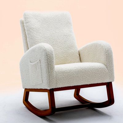 a white rocking chair with wooden legs on a white background in the shape of a recliner