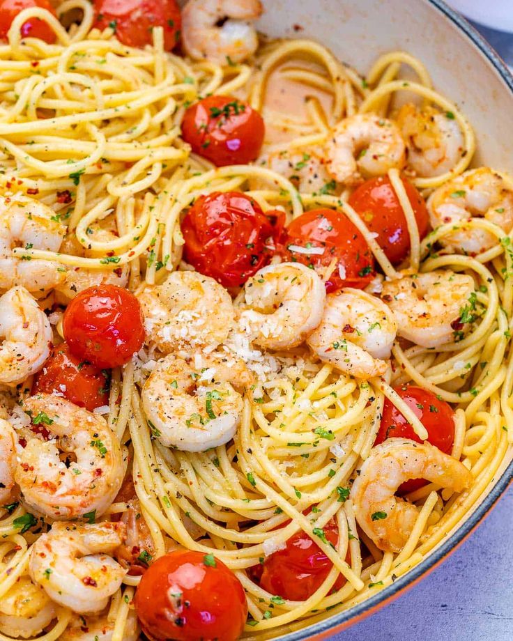 pasta with shrimp and cherry tomatoes in a skillet