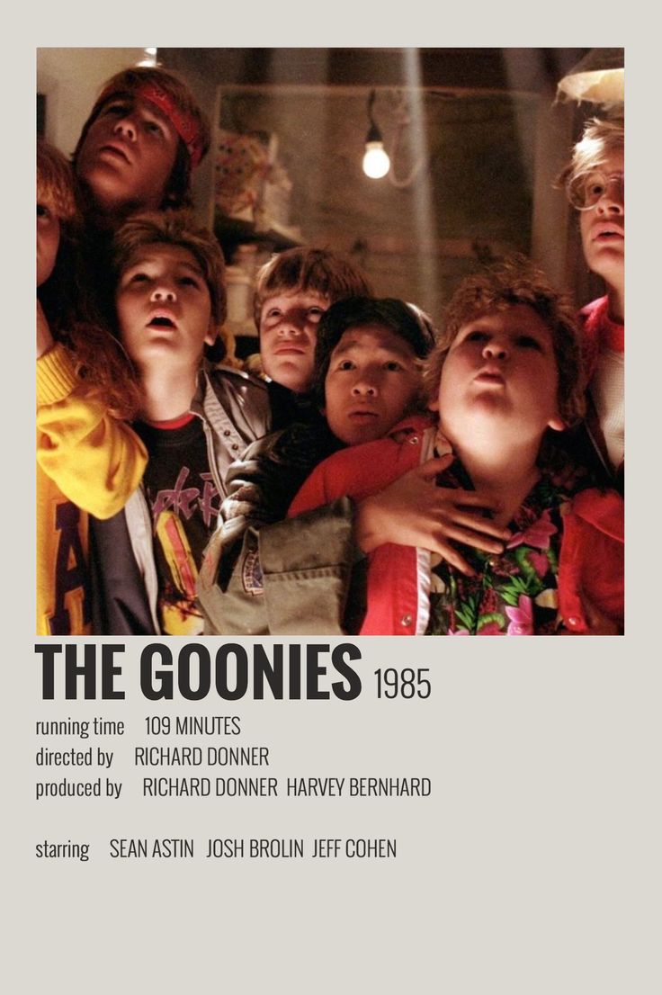 the goonies movie poster with many children looking up at something in the air,