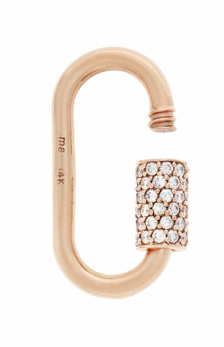 a rose gold ring with white diamonds on the outside and an open loop in the middle