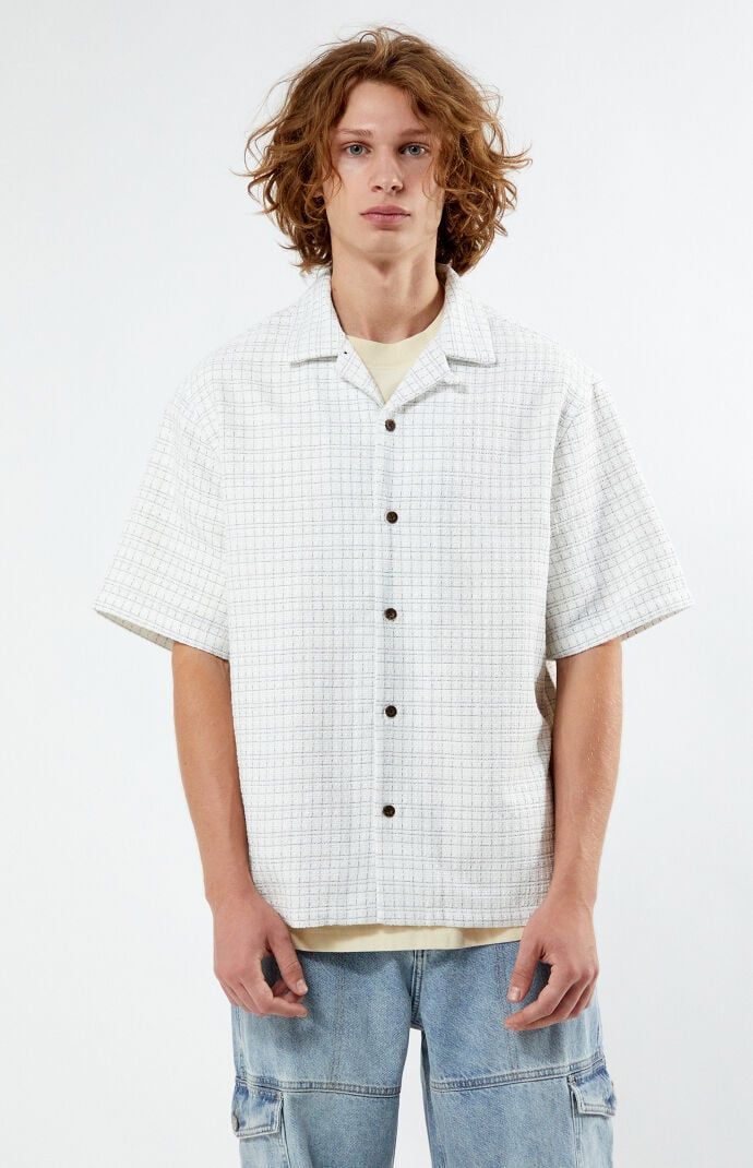 Add a touch of sophistication to your casual collection with the Textured Oversized Camp Shirt from PacSun. Featuring a relaxed fit, classic collared neckline, and short sleeves, this shirt is crafted from textured fabric for a unique and stylish look.Collared necklineShort sleevesRelaxed fitButton closuresTextured woven fabrication100% PolyesterMachine washableModel is wearing size mediumModel Measurements: 6â3â Height, 28â Waist, 33.5â Hips PacSun Mens Textured Oversized Camp Shirt - White size Small White Relaxed Fit Shirt With Camp Collar, White Relaxed Fit Collared Camp Shirt, White Relaxed Fit Camp Shirt With Spread Collar, Relaxed Fit Shirt With Camp Collar For Casual Gatherings, Casual Relaxed Fit Short Sleeve Shirt With Spread Collar, Casual Short Sleeve Shirt With Spread Collar, Relaxed Fit Shirt With Rolled Sleeves, Casual Short Sleeve Shirt With Relaxed Fit, Casual White Johnny Collar Short Sleeve Shirt