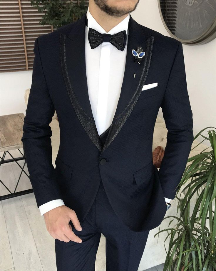 This men's blue tuxedo suit is a must-have for any modern gentleman's formal wear collection. When you want to make a stylish entrance at your next event, this stunning slim-fit blue blazer will help you do just that. Crafted from high-quality materials, this single-breasted tuxedo jacket is fully lined and features two exterior pockets. Perfect for formal occasions, this tuxedo ensures you look sharp and confident, offering great versatility and a flattering fit for your body. Remarks : Dry Clean Only Silk Satin Peak collar Material: 65% Polyester, 32% Viscose, 3% Lycra Cutting: Single Button, Double Slits Package included : Jacket, Vest & Pants Mens Suit For Wedding, Slim Fit Groom Suit, Tuxedo Prom, Suit 3 Piece, Suit For Wedding, Blue Tuxedo, Blue Tuxedos, Groomsmen Suits, Tuxedo Suit