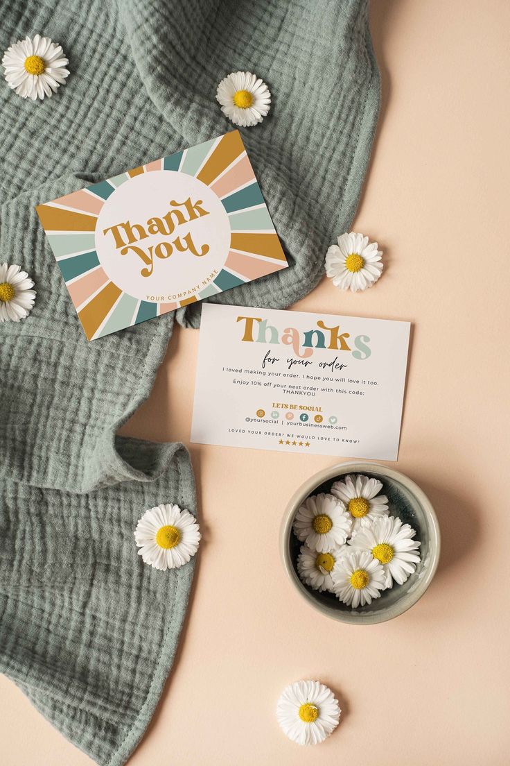 thank you card with daisies in a bowl next to it