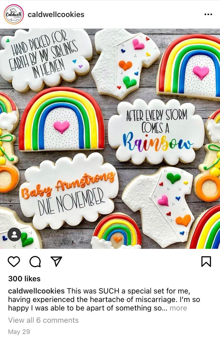 some cookies are decorated with rainbows, clouds and other things on them for someone's special occasion