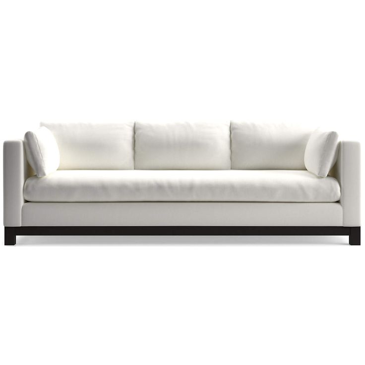 a white couch sitting on top of a wooden frame