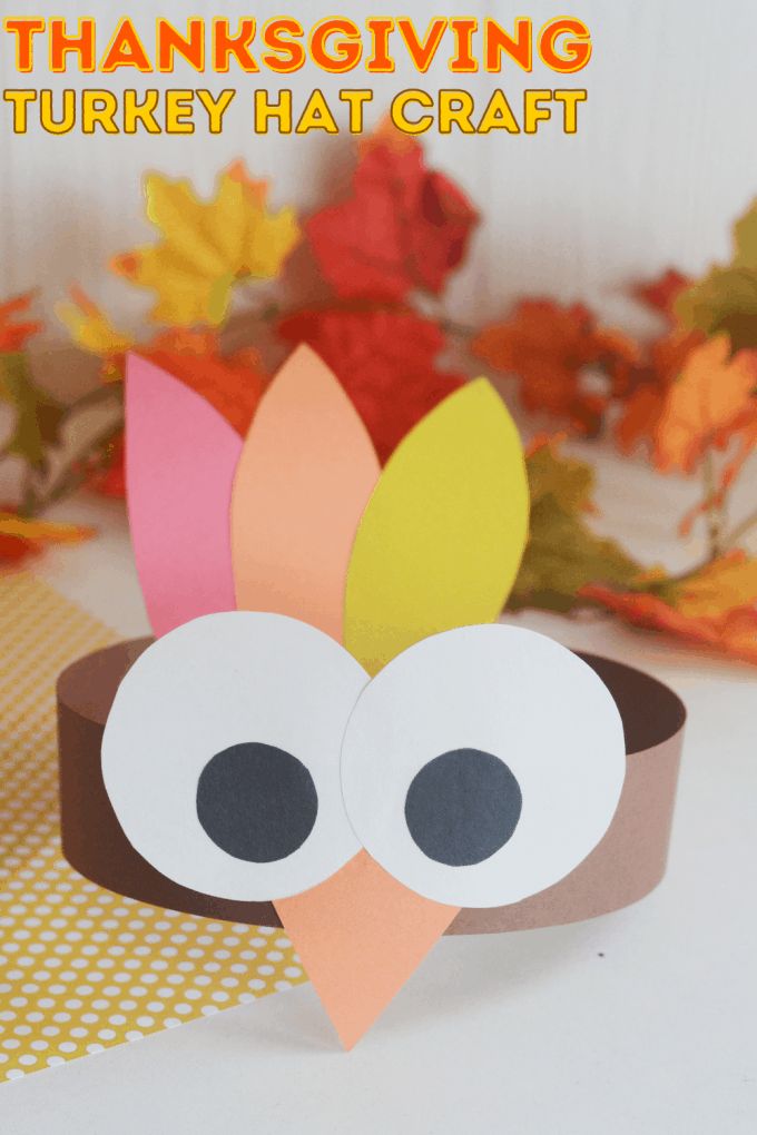 a turkey hat made out of paper with the words thanksgiving turkey hat craft on it