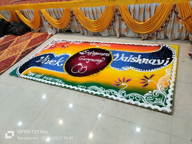 a decorated floor mat with the words happy diwali on it