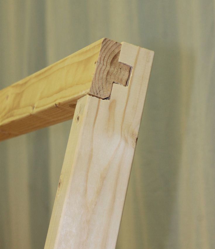 a close up of a piece of wood with a wooden cross on the top and bottom