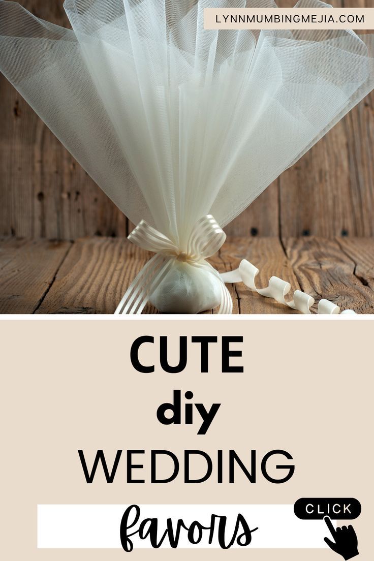 a white bag filled with wedding favors sitting on top of a wooden table next to a fork