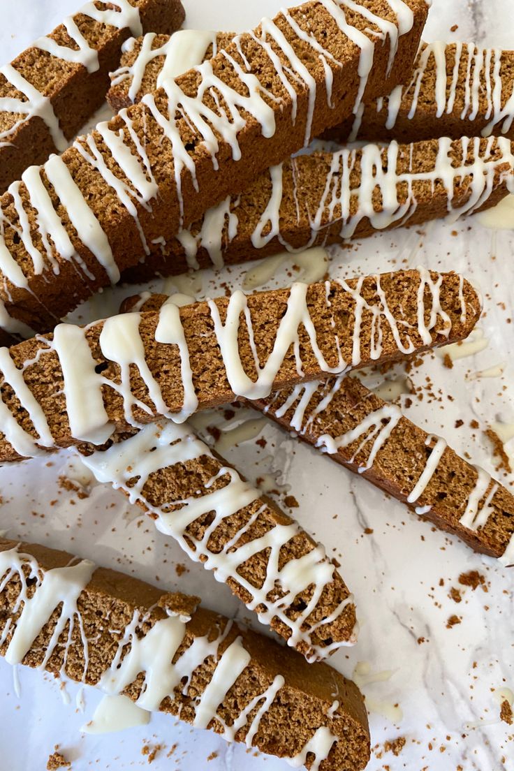 several pieces of bread with white icing on them