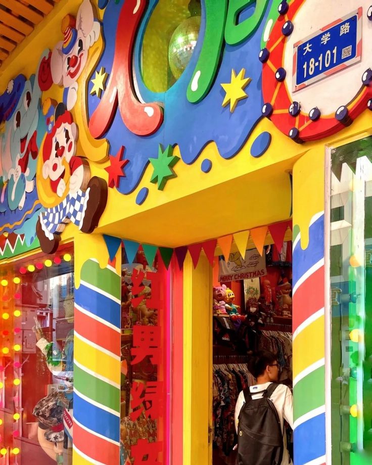 a colorful store front with children's clothing on display