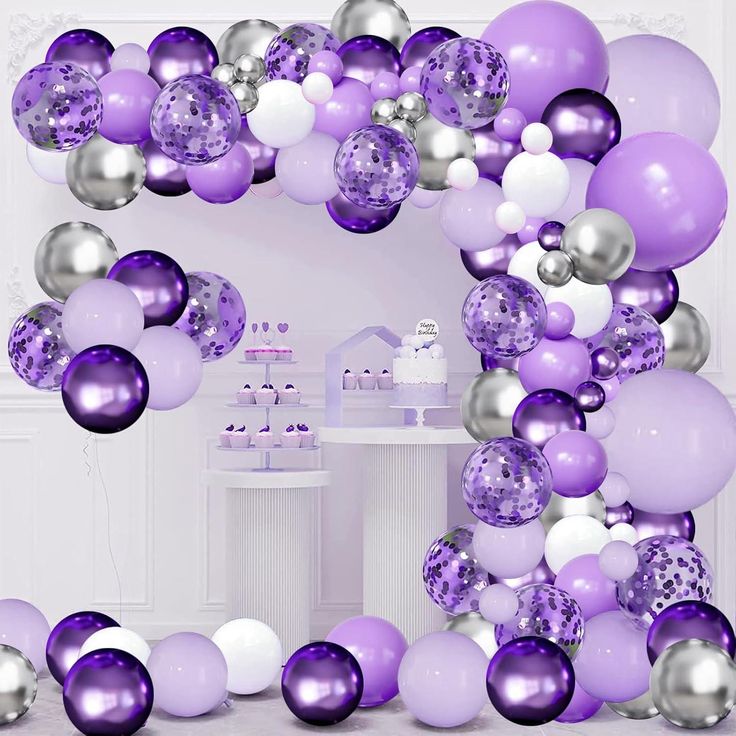 purple and silver balloons are in the shape of an o - letter for a birthday party