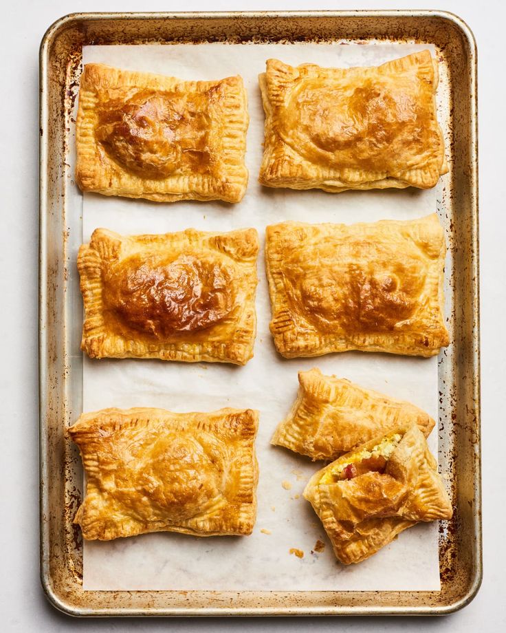 baked pastries on a baking sheet ready to go into the oven for dinner or dessert