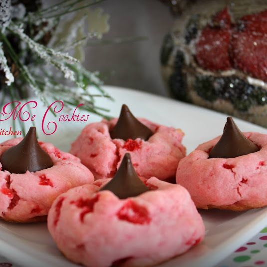 some pink cookies with chocolate on them