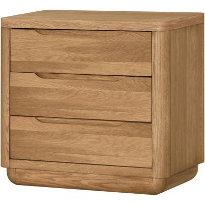 a wooden chest of drawers with three drawers