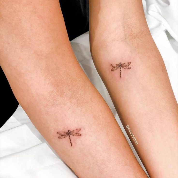 two small dragonfly tattoos on both legs