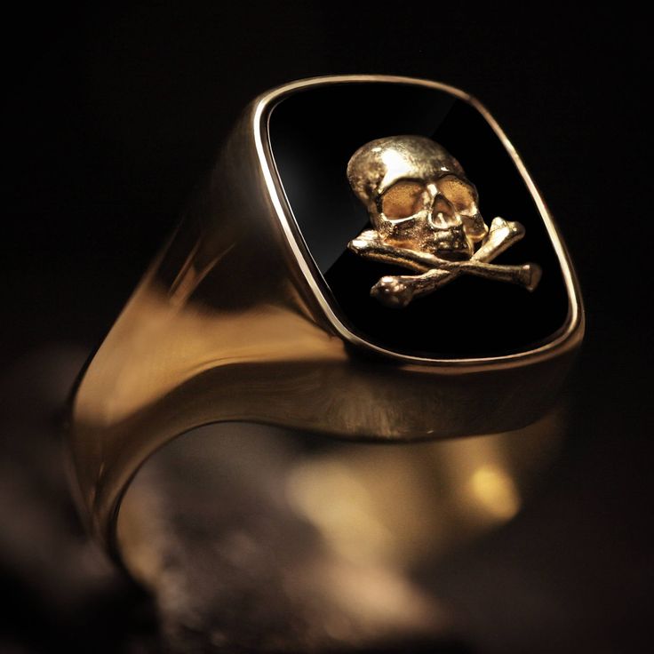 "Considered the \"gentleman's ring\", there doesn't seem to be a more perfect piece of jewelry to proudly wear than the signet ring. Our 18kt. gold signet ring is very unique with a straight oval deep black onyx stone set within. On top of the onyx sits a 18kt. golden skull and crossbones design. Shipping&Processing Since all our items are individually handmade, we need about 4 weeks (at most) to make your item. Shipping is on us, we use DHL express so it will only take 3 days on average. Pa 14k Gold Timeless Signet Ring For Collectible, 14k Gold Timeless Signet Ring Collectible, Timeless 14k Gold Signet Ring For Collectors, 14k Gold Signet Ring With Polished Finish, Gold Signet Ring With Polished Finish For Collectors, Timeless Gold Signet Ring, Timeless Hallmarked Signet Ring Collectible, Gold 14k Stamped Signet Ring For Formal Occasions, Formal Gold Signet Ring Stamped 14k