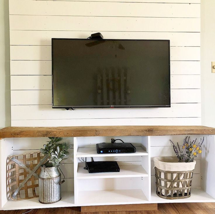 a flat screen tv mounted to the side of a wall