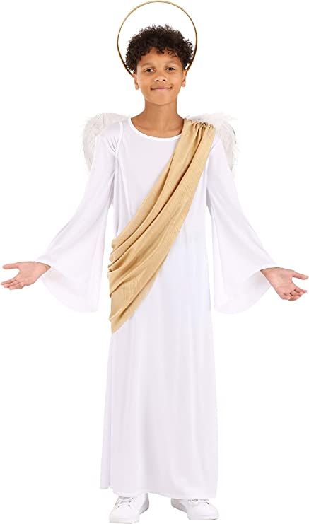 a young boy dressed in an angel costume