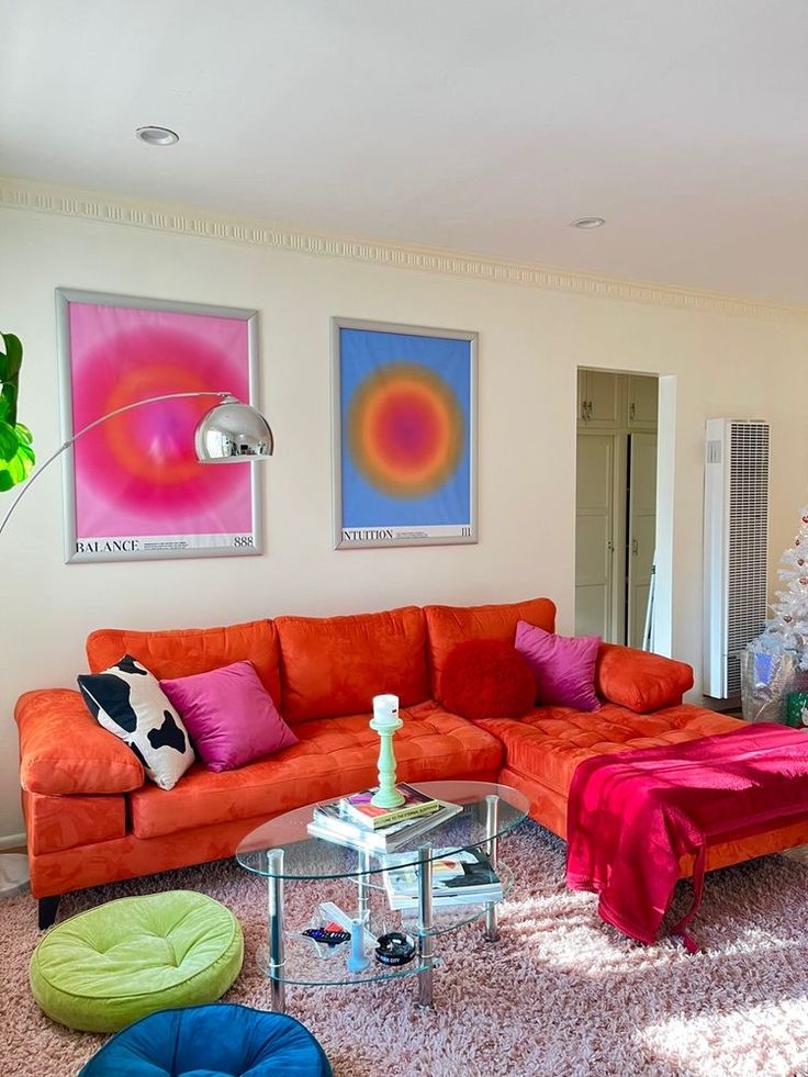 a living room filled with lots of furniture next to a christmas tree in the corner