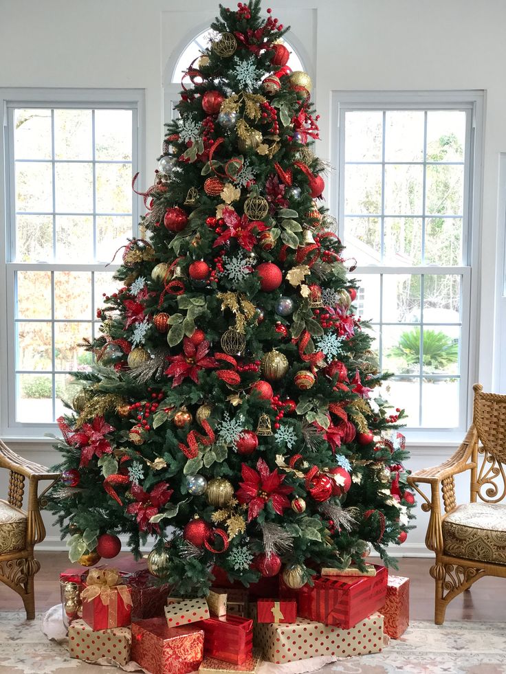 a decorated christmas tree with presents under it