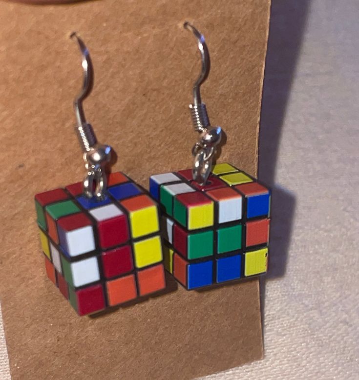 Mini rubix cube-inspired earrings. A one-of-kind gift for the classic puzzle lover! Square Multicolor Earrings For Gift, Square Hypoallergenic Earrings For Gift, Hypoallergenic Square Earrings For Gifting, Hypoallergenic Square Earrings As Gift, Hypoallergenic Square Earrings For Gifts, Retro Hypoallergenic Earrings For Gift, Multicolor Square Jewelry Gift, Multicolor Square Jewelry For Gifts, Multicolor Rectangular Earrings As A Gift