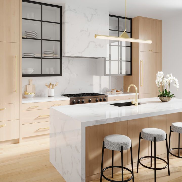 a kitchen with marble counter tops and stools next to an island in the middle