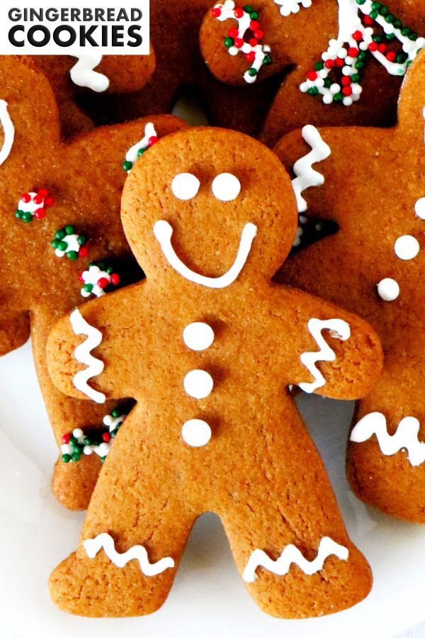 a plate full of gingerbread cookies with sprinkles on them and the words gingerbread cookies above it