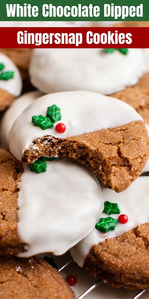 white chocolate dipped ginger snap cookies on a cooling rack