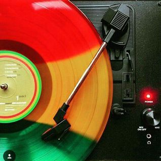 an old record player with colorful vinyl on it