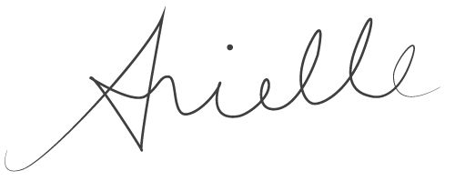 the word amelie written in cursive writing on a white background with black ink