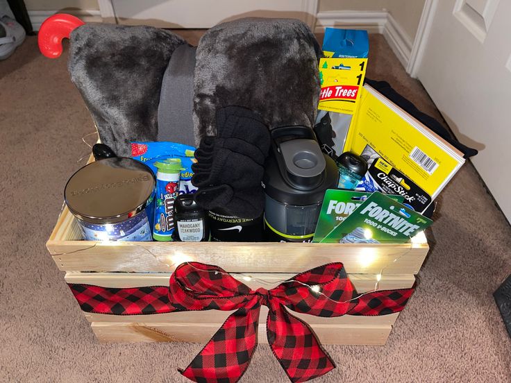 a wooden box filled with items on the floor