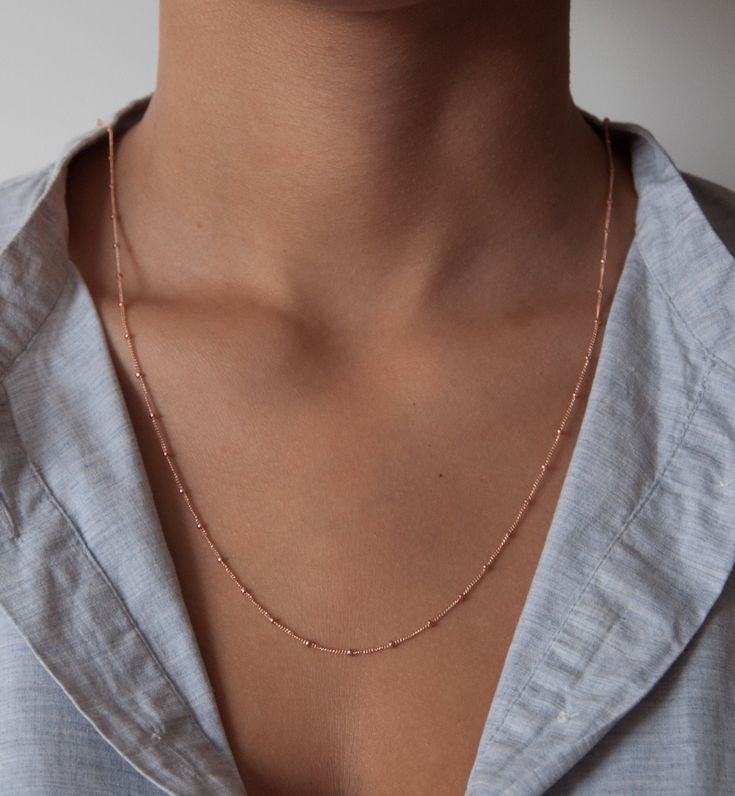 One of our favorite necklaces is the beaded satellite chain. This delicate curb chain is dotted with tiny 2mm beads every 14mm. We love this chain as a single or wrapped around twice as a double. Choose your own perfect length. Details: 14k solid gold chain 14k solid gold clasp * in the images you can see the necklace as a 14, 16,18 and 36-inch examples. The double wrapped necklace is 36 inches. We take pride in offering our customers the very best in fine jewelry. That's why we create stunning Minimalist Station Necklace With Satellite Chain As A Gift, Minimalist Station Necklace With Satellite Chain For Gift, Dainty Station Necklace With Satellite Chain, Minimalist Satellite Chain Necklace For Layering, Dainty Everyday Necklace With Satellite Chain, Dainty Station Necklace With Delicate Chain, Delicate Satellite Chain Necklace For Everyday, Dainty Everyday Satellite Chain Necklace, Dainty Satellite Chain Necklace