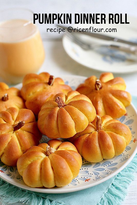 small pumpkins are arranged on a plate with blue and white table cloth next to them