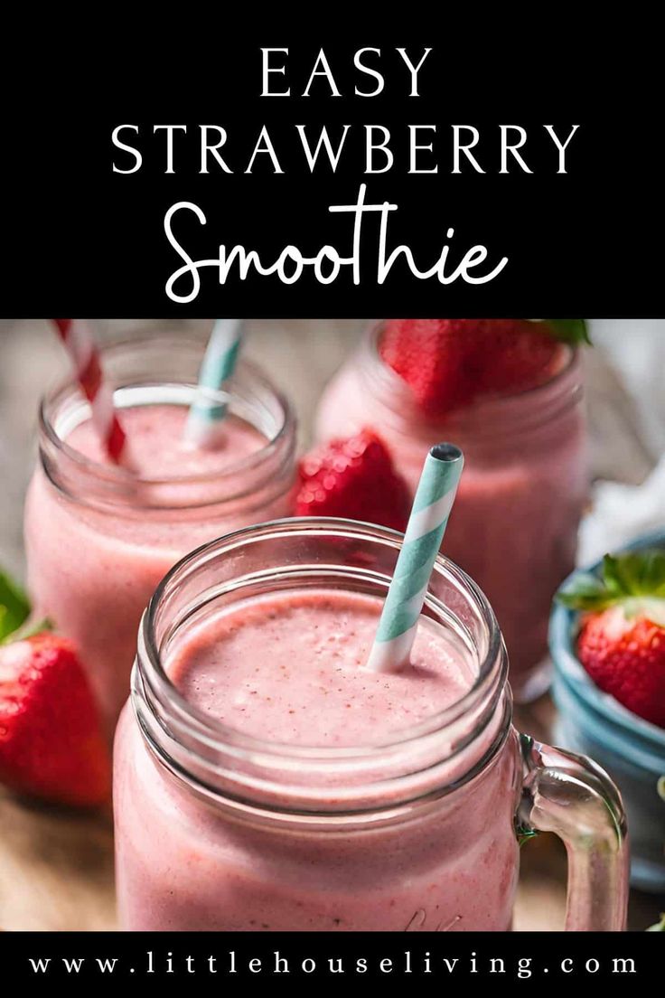 two mason jars filled with strawberry smoothie and strawberries