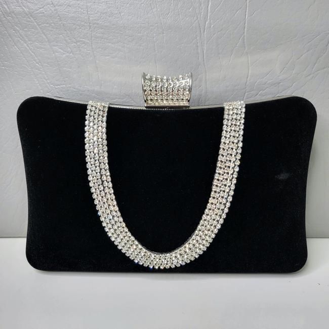 For a more sophisticated take on the classic clutch bag, the Velvet Flask Dinner Bag is sure to please. It features a flask shape design, embellished with an array of sparkling crystals, and an elegant clasp closure. Available in red and black. This elegant clutch bag adds just the right amount of glitz to make any outfit shine! Elegant Rectangular Evening Bag For Cocktail, Elegant Handheld Clutch With Chain Strap, Silver Rectangular Clutch For Cocktail, Rectangular Silver Evening Bag For Cocktail, Silver Rectangular Evening Bag For Cocktail, Glamorous Rectangular Cocktail Evening Bag, Evening Handheld Clutch With Rhinestones, Handheld Rhinestone Clutch For Evening, Rectangular Silver Bag For Cocktail