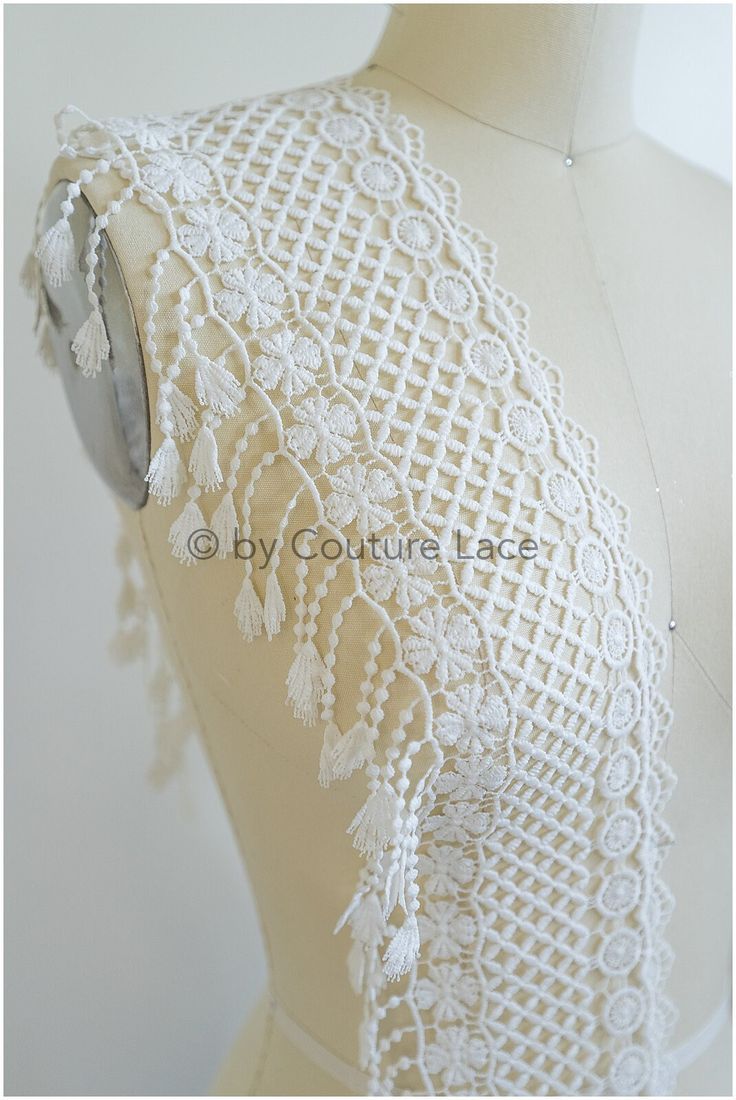 the back of a mannequin with white lace on it