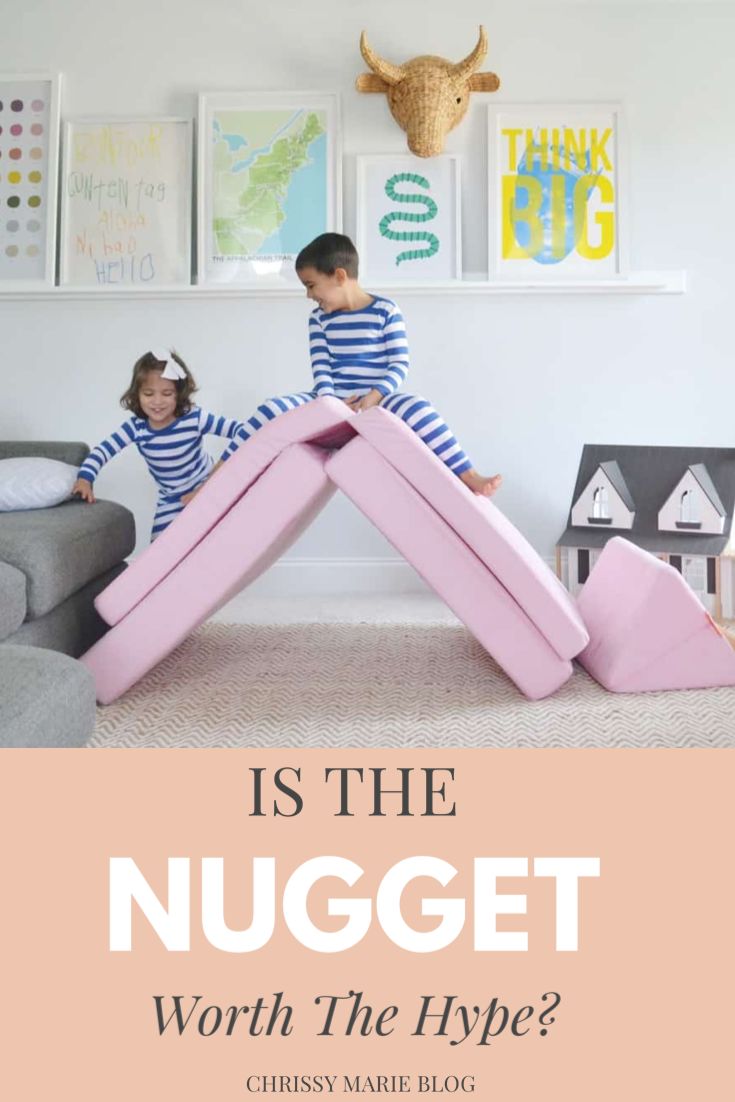 two children sitting on large pink inflatable letters with the words is the nugget worth the hype?