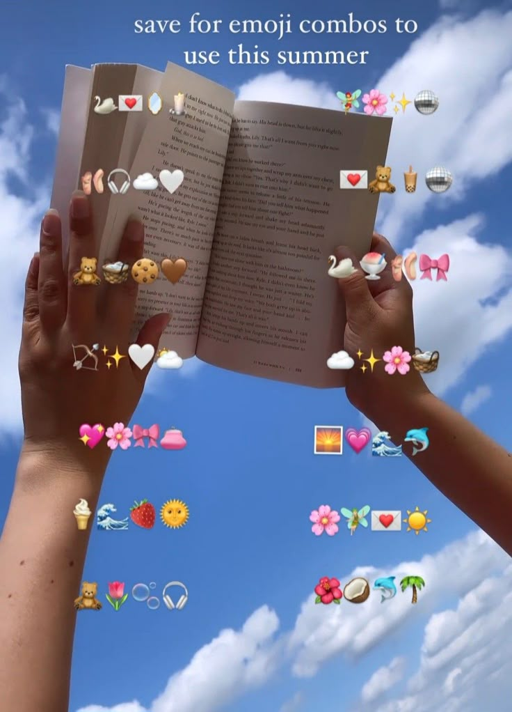 two hands are holding an open book with emoj icons coming out of the pages