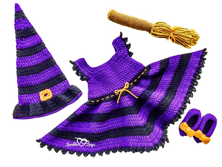 a purple and black knitted wizard outfit with hat, booties and wand on white background