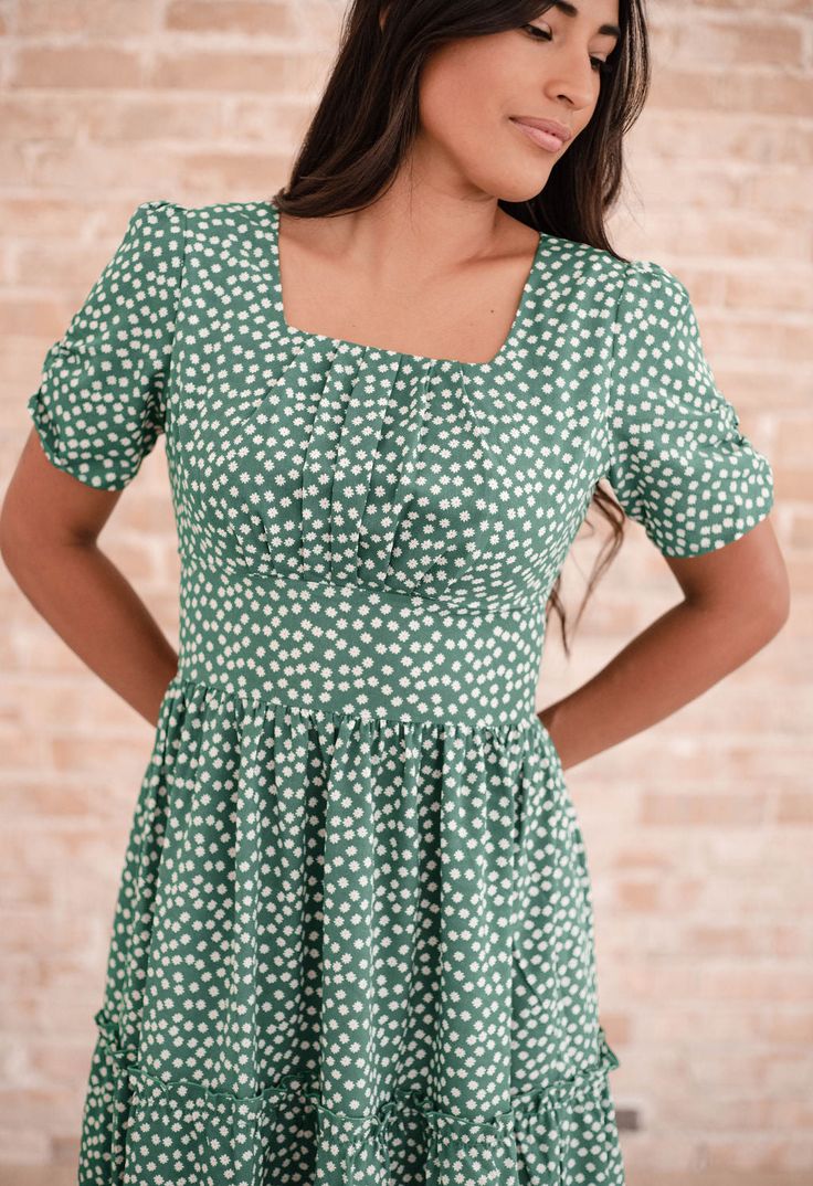 The dress that started it all, the Limerick Dress is the most comfortable and versatile midi dress you may ever own. Definitely a fan favorite, this green floral dress features a romantic midi-length skirt and a square neckline. The flattering silhouette is enhanced by the wide waistband and pleated bust detailing. This dress is seriously so comfy, we promise that making this a wardrobe staple will not be a miss. All Poet dresses come with a cardstock poem delivered in a wax-sealed envelope. 🪶 Green Mini Dress With Straight Neckline For Brunch, Green Spring Dress With Straight Neckline, Chic Square Neck Ditsy Floral Print Dress, Green Mid-length Sundress, Floral Print Square Neck Midi Sundress, Spring Square Neck Ditsy Floral Midi Dress, Floral Print Midi Dress With Square Neck, Spring Square Neck Midi Dress With Ditsy Floral Print, Floral Print Midi Sundress With Square Neck