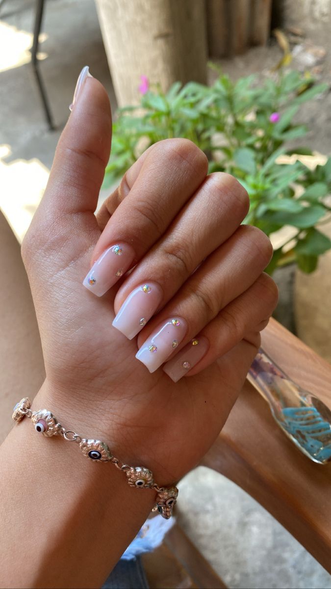 Square nails gems evil eye bracelet Square Nails Diamonds, Square French Tip With Gems, Short Pink Nails With Gems, Simple Nails Diamonds, Righstones On Nails, Kaci Jay Nails, Square Gem Nails, Gemstone Nails Rhinestones, Square Nails With Jewels