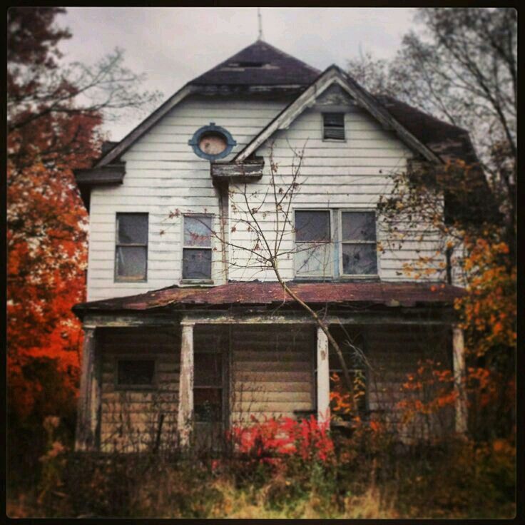 an old run down house in the fall